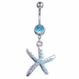 Silver starfish navel ring with blue gems and nautical pendant on white background