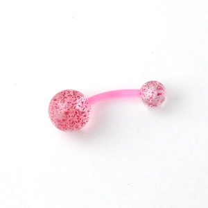 Macro shot of curved acrylic belly ring with pink glitter-filled transparent balls
