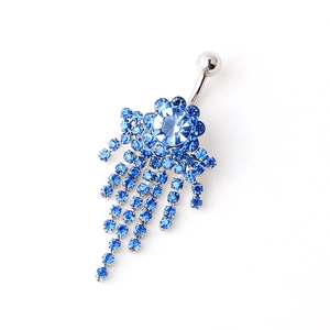 Sparkling blue flower navel ring with crystal tassels on a minimalist white background