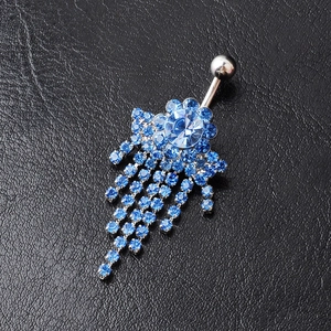 Silver belly button ring with blue crystal flower and cascading rhinestone tassels on leather