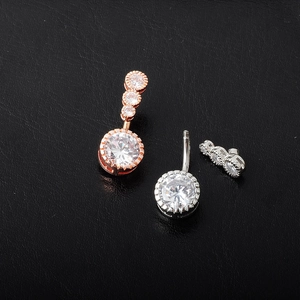 Elegant opal and zircon navel ring set in rose gold and silver finish on black leather
