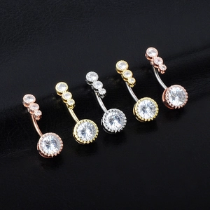 Five sets of curved navel rings in gold and silver steel with cubic zirconia stones