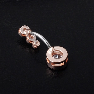 Rose gold belly button ring with curved barbell and shimmering cubic zirconia pavé