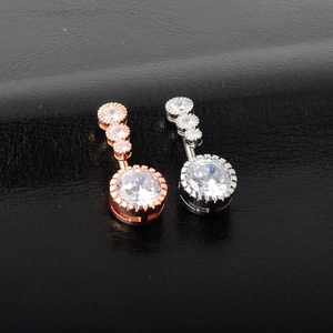 Vertical belly button rings in silver and rose gold with sparkling round cubic zirconia