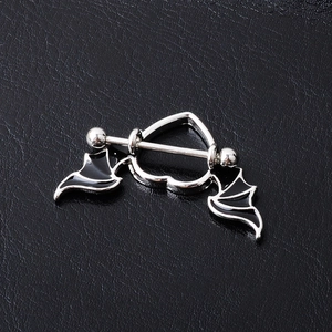 Detail of bat wing heart nipple shield in black and silver polished stainless steel