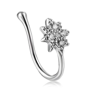 Close-up of silver U-shaped nose ring clip featuring a sparkling zircon flower design