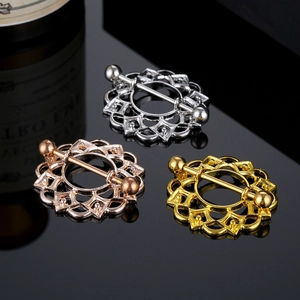 Drie holle zonnebloem tepelpiercings in zilver, goud en roosgoud met metalen staaf