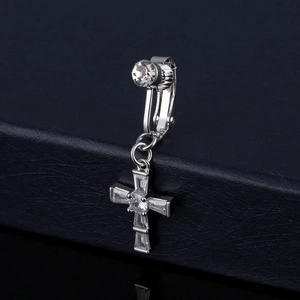 Silver cross navel piercing ring set with sparkling AAA cubic zirconia on blue texture