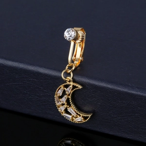 Detailed close-up of golden crescent moon navel ring with inlaid sparkling zircon stones
