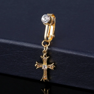 Macro view of golden cross belly button ring with inlaid AA zircons and polished finish