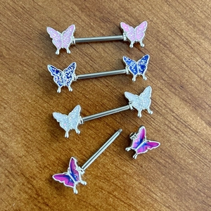 Set of four butterfly nipple barbells in colorful glitter enamel and surgical steel