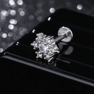 Star-shaped stainless steel ear stud with clear cubic zirconia and screw back