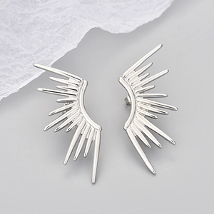 Polished silver wing sunburst stud earrings with creative metallic spiked design for women