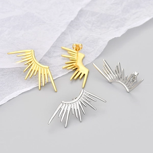 Fashionable geometric sunburst wing stud earrings in gold and silver metal finishes