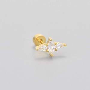 Macro detail of gold stud earring with marquise and pear crystals and screw back