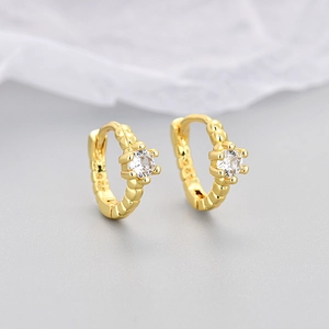 Close-up of gold-plated S925 silver hoop earrings with textured finish and clear round zircon
