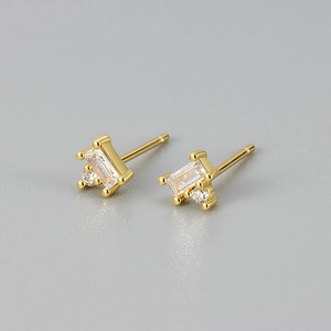 Macro shot of rectangular zircon stud earrings with 18K gold plating and claw setting