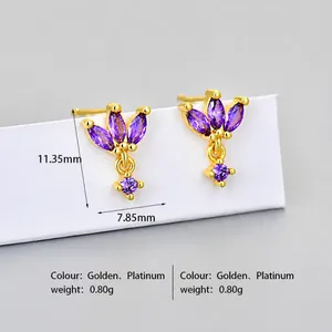 Detailed macro view showing the 11.35mm purple marquise crystal stud earrings with gold finish
