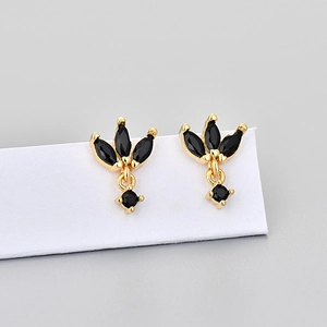 Close-up of golden marquise-cut black stone earrings with crown design on white card