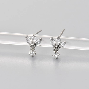Detail of silver stud earrings featuring marquise and round cut sparkling zircons