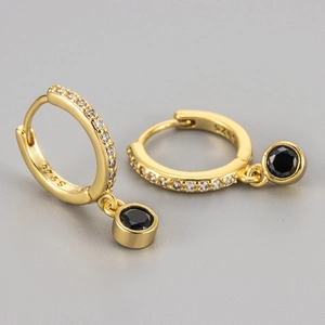 Detailed close-up of S925 gold-plated earrings with black gemstone and zircon pavé