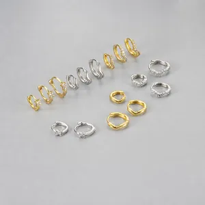 Detailed view of cubic zirconia earrings set showing various sizes and gold finishes