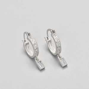 Silver hoop earrings with engraved stars and dangling rectangular zircon pendants