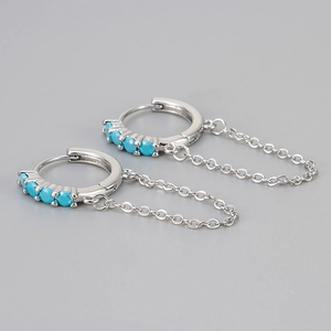 Silver hoop earrings with turquoise stones and delicate chain fringe in a minimalist style