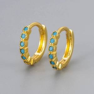 Minimalist gold huggie hoop earrings featuring five round turquoise stones inlay