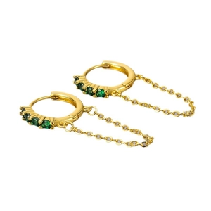 Gold hoop earrings with emerald green zircons and a delicate connecting chain links