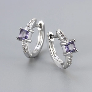 Detailed macro shot of S925 sterling silver hoop earrings with square purple zircon stones