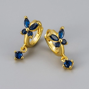 Elegant gold butterfly hoop earrings with deep blue zircon stones for a stylish look