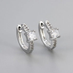 Macro shot of S925 sterling silver square zircon hoop earrings with polished finish
