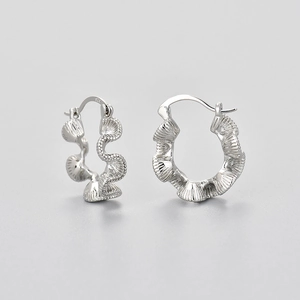 Textured sterling silver hoop earrings with ripple design and S925 engraving details