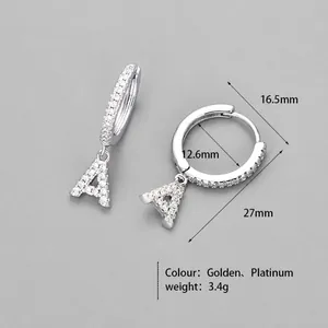 Macro detail of silver letter A earring with sparkling cubic zirconia pavé setting