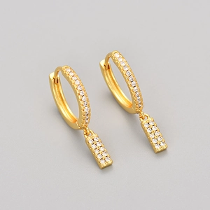 Detailed view of gold hoop earrings with micro-pave white zircon rectangular pendants