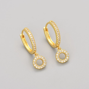 Elegant gold letter hoops with micro-set zircons on a gray minimalist background
