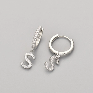 Detail of silver letter S pendant earrings with micro-pave cubic zirconia stones