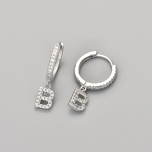 Elegant silver huggie hoop earrings with sparkling crystal letter B alphabet pendant