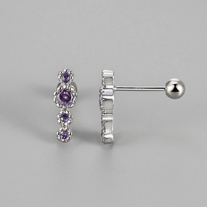 Detailed macro view of S925 silver stud earrings with four purple zircon stones
