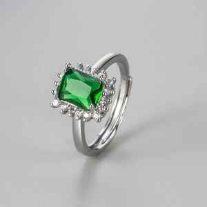 Adjustable silver ring featuring emerald cut green zircon with halo crystal accents