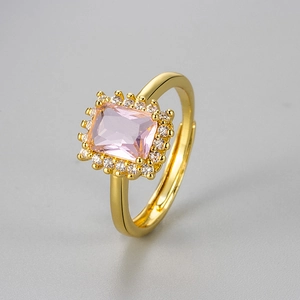 Adjustable gold plated ring featuring radiant cut pink zircon in a classic halo setting