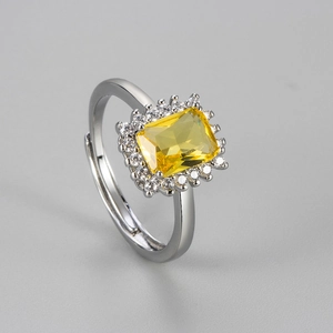 Elegant adjustable open ring featuring a rectangular yellow gemstone with halo small diamonds