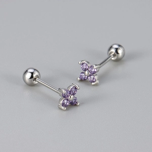 Detailed macro of silver clover stud earrings with purple zircons and screw back