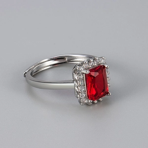 Detail of red rectangular zircon ring with pave setting and adjustable open band