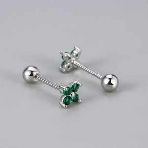 Detail of silver screw-back studs with four-leaf clover green zircon inlay