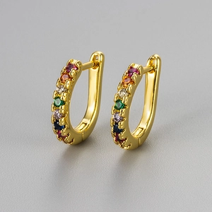 Golden U-shaped hoop earrings with colorful rainbow cubic zirconia in a minimalist style