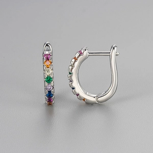 Silver curved hoop earrings with a colorful rainbow row of inlaid multi-colored crystals
