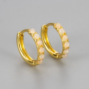 Elegant gold hoop earrings featuring minimalist round white opal stones for women