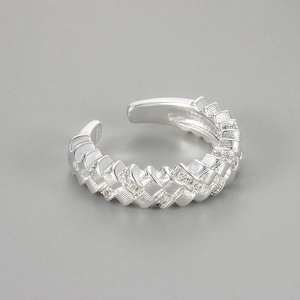 Detail view of woven textured silver ring with micro-set zircons and brushed finish